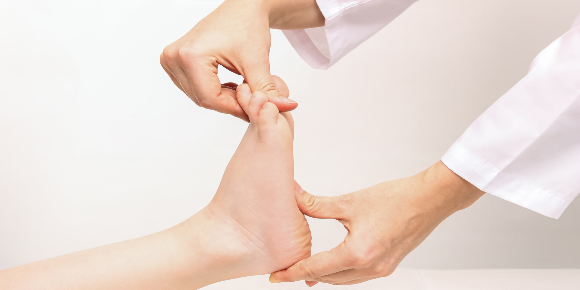 Podiatrist examining a patient's foot